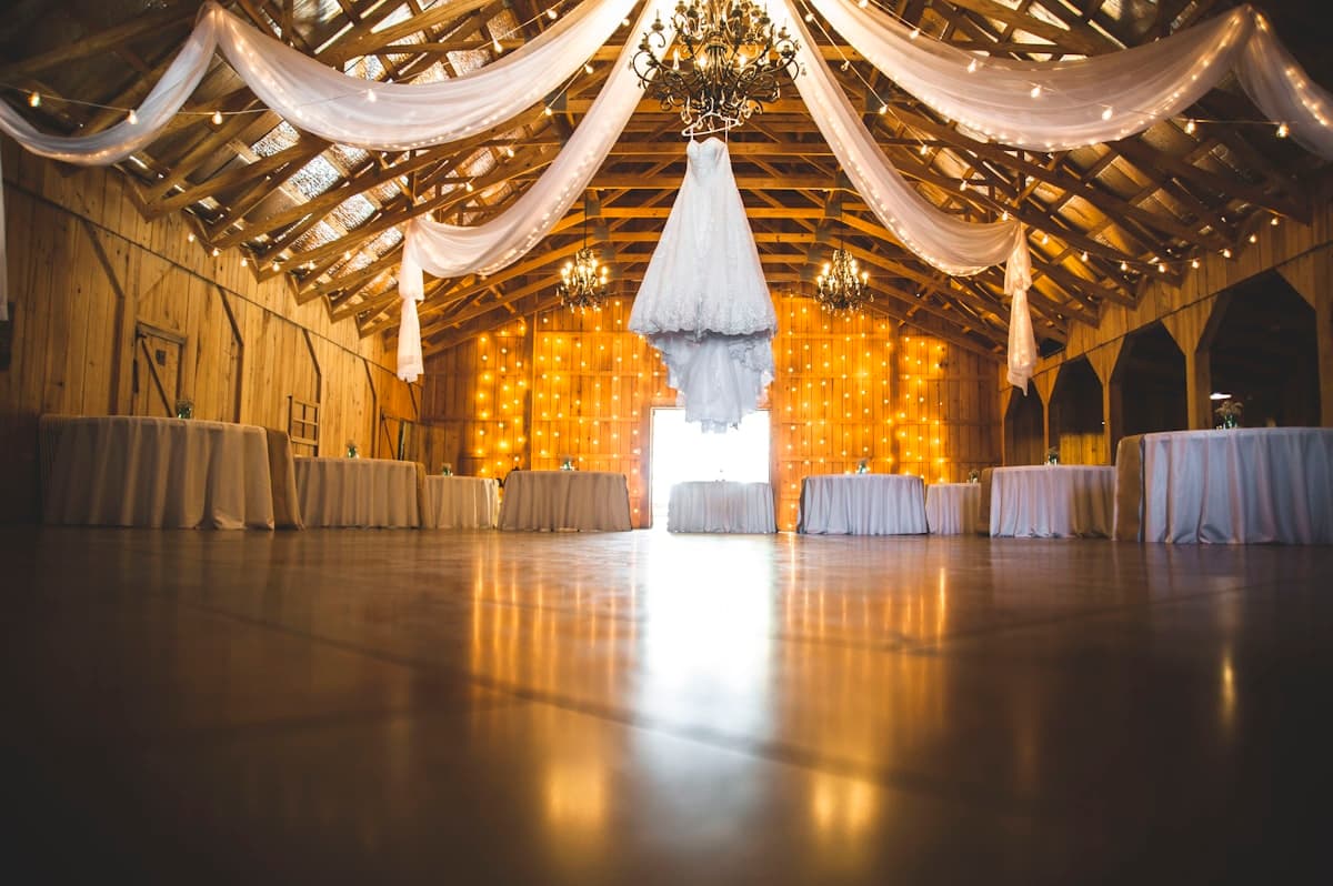 A composed arrangement of wedding florals on a reception table